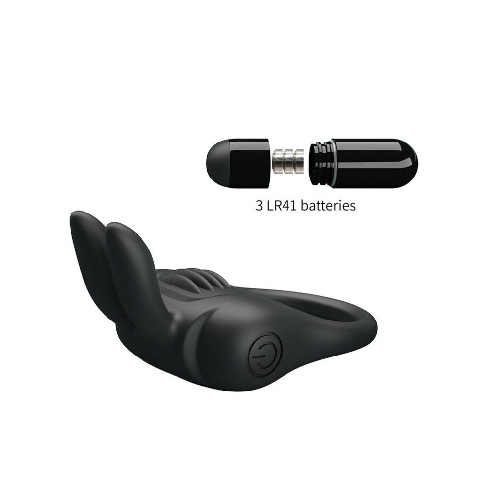Anello fallico nero con orecchie da coniglio e vibratore. Vibratore smontato, batterie visibili.