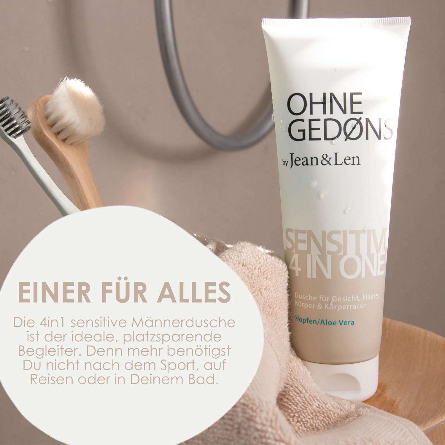 Tubo OHNE GEDØNS by Jean & Len, Sensitive 4in1, accanto ad asciugamano, spazzola e sapone.