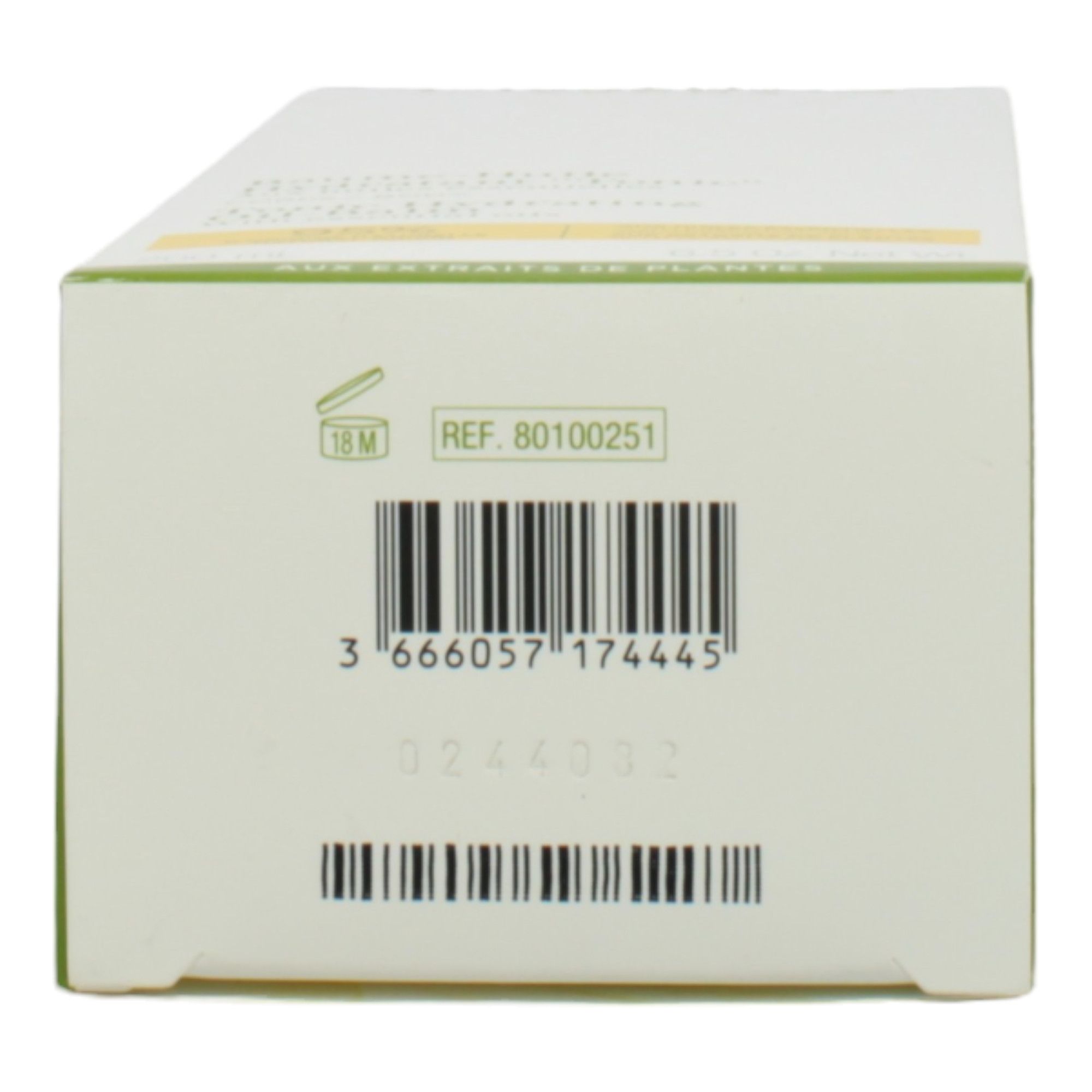 Confezione in cartone. Codice a barre, riferimento e data di produzione. Tonalità verde e beige.