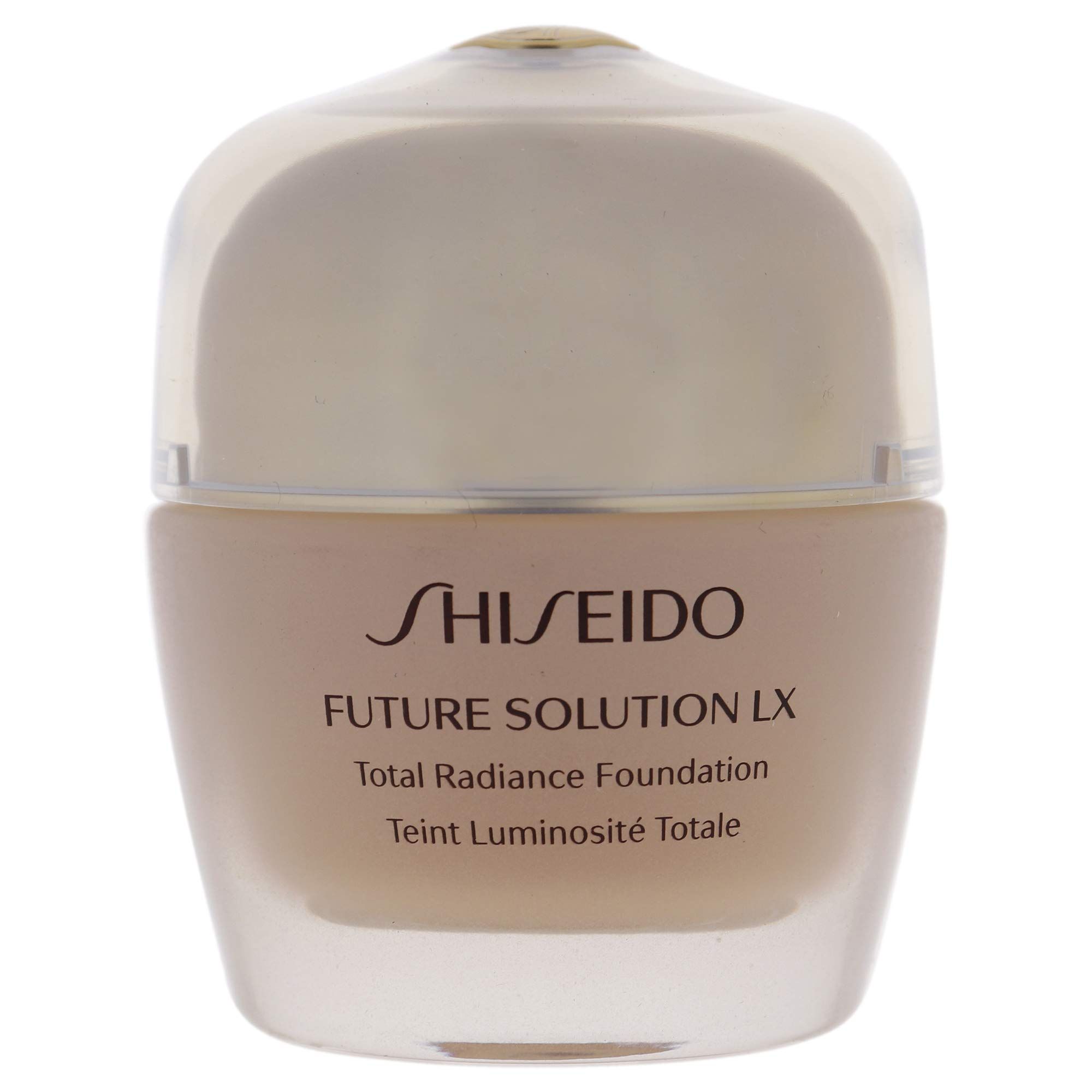 Fondotinta beige in un contenitore di vetro con coperchio trasparente. Scritta: SHISEIDO, FUTURE SOLUTION LX, Total Radiance Foundation.
