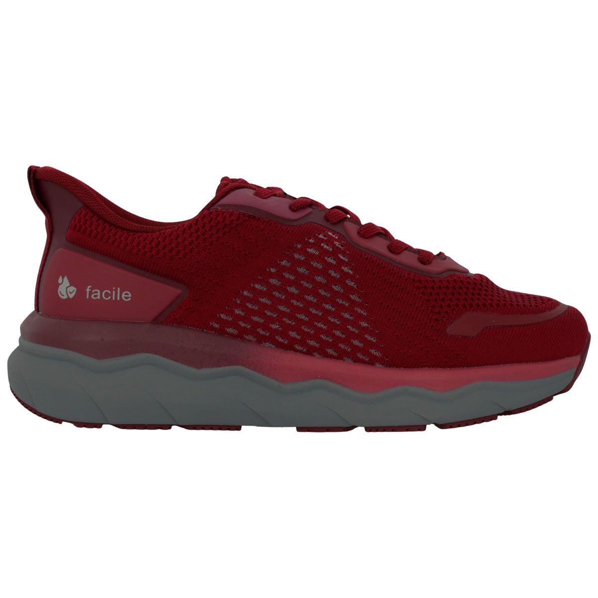 Scarpa sportiva grigia con accenti rosa pallido, lacci e suola beige.