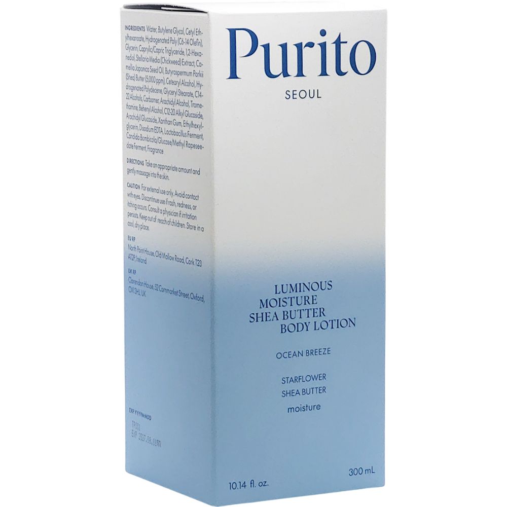Confezione bianca con sfumatura blu chiaro. Scritta: Purito Seoul, Luminous Moisture Shea Butter Body Lotion, Ocean Breeze.