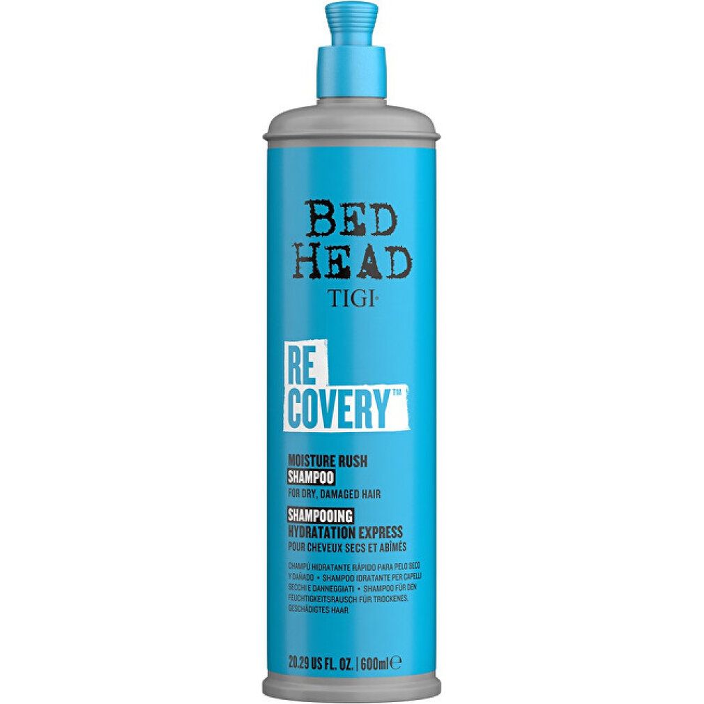 Flacone di shampoo alto turchese con erogatore grigio. Bed Head Tigi Recovery Shampoo, testo sull'etichetta.