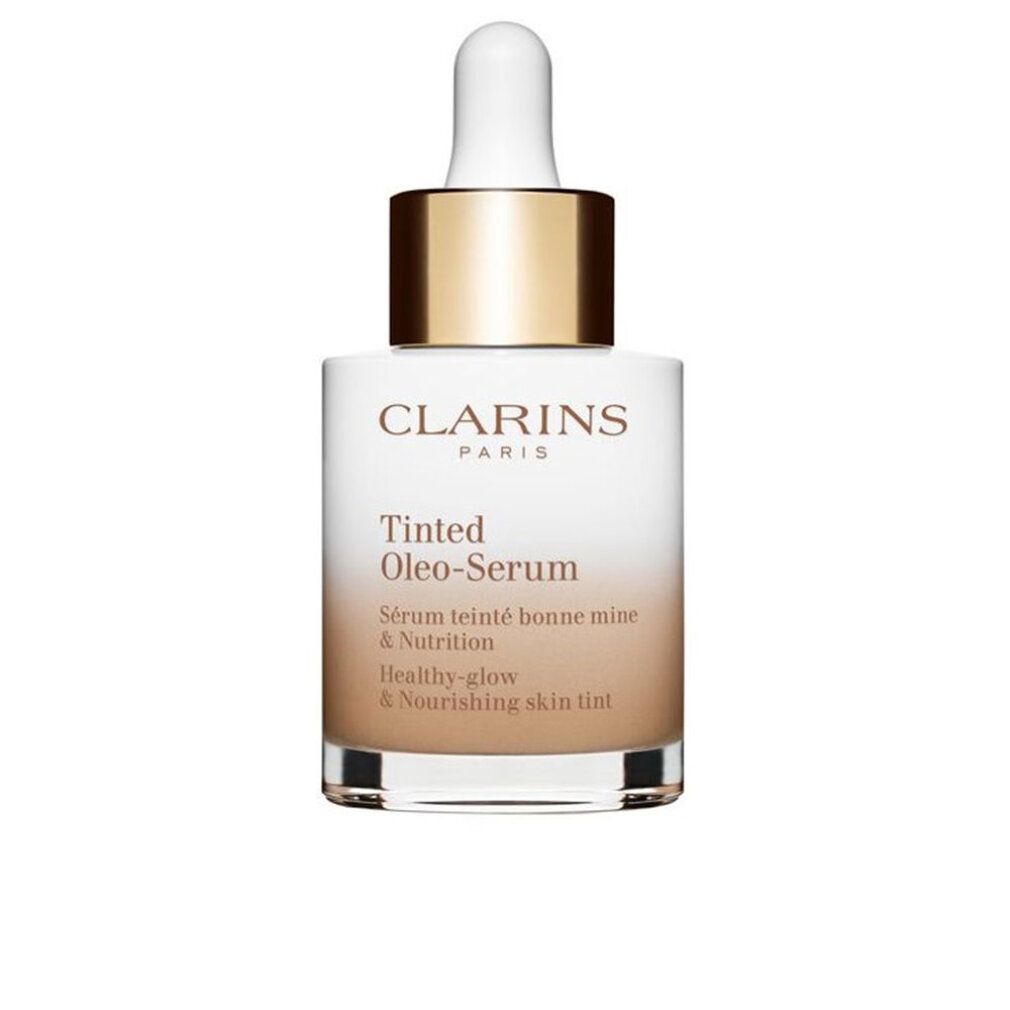 Clarins Siero Oleo-Tintato. Flacone con contagocce. Vetro bianco, tappo dorato. Nome prodotto e testo sul flacone.