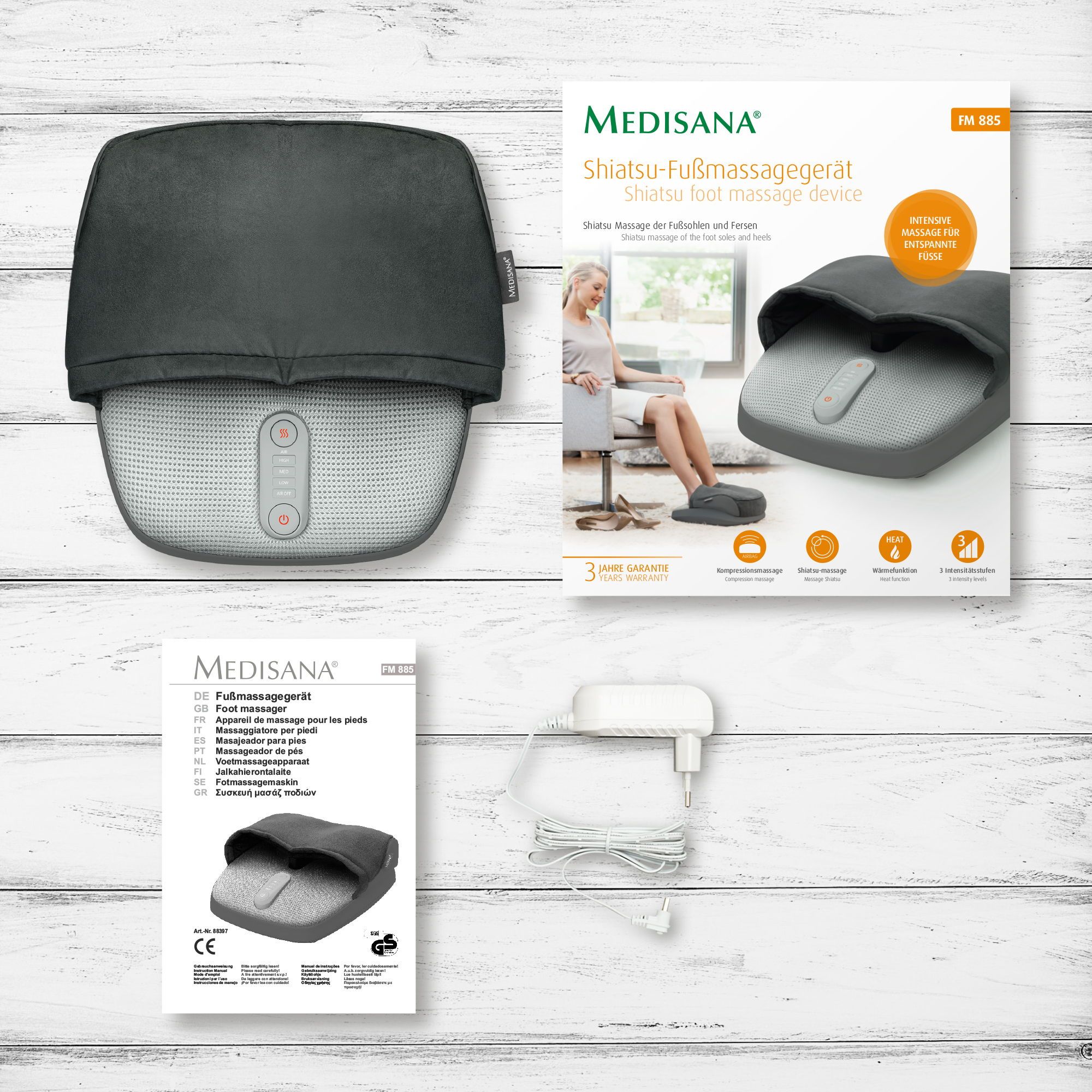 Massaggiatore plantare Shiatsu con confezione, manuale e alimentatore.