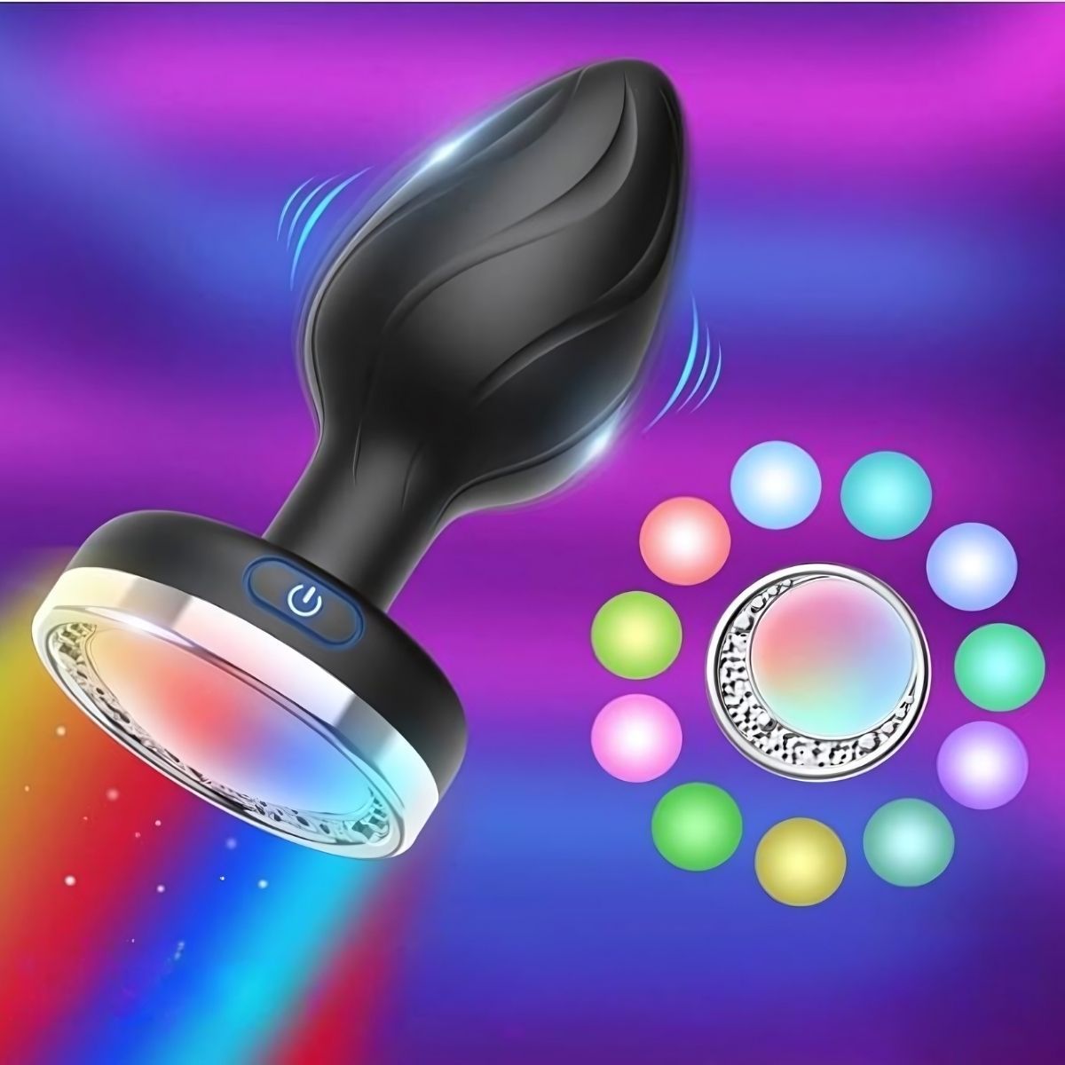 Plug anale nero con anello luminoso colorato. Il plug ha una forma curva e un pulsante. Diverse sfere colorate attorno al plug.