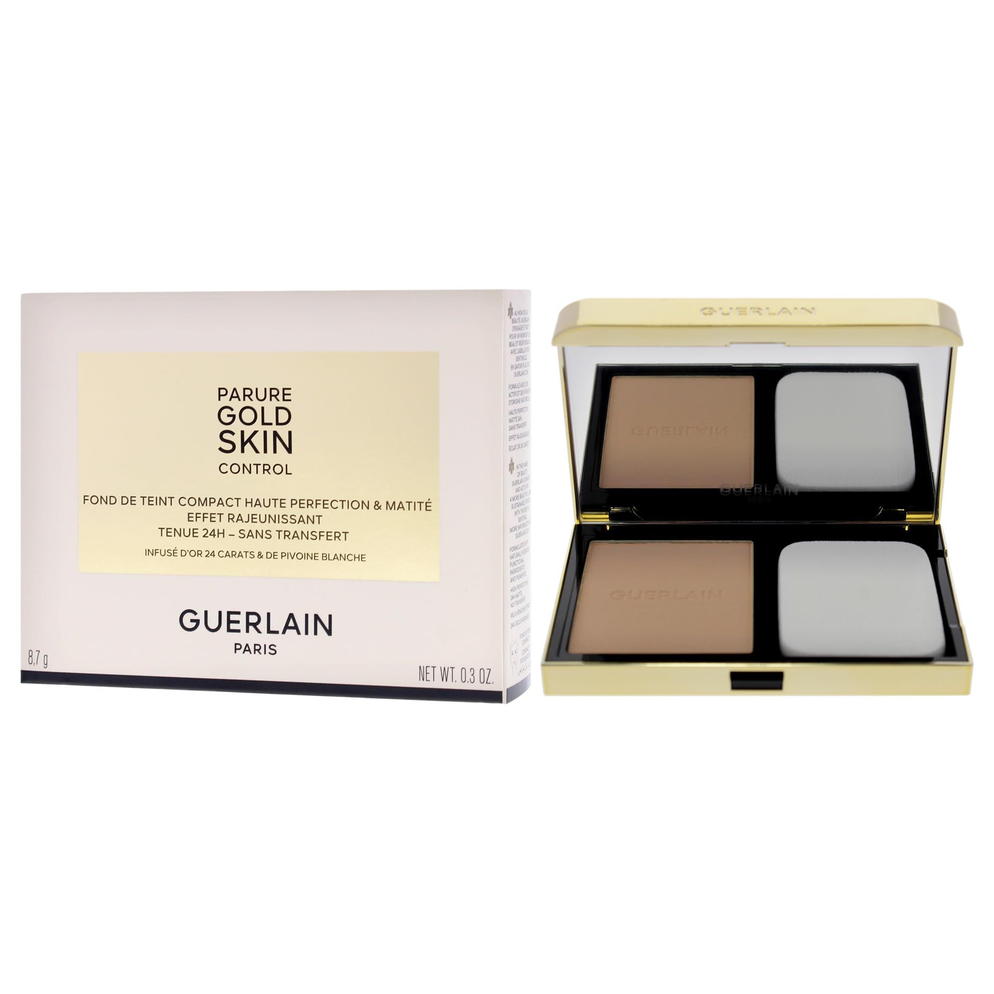 Cipria compatta con specchio e applicatore. Custodia dorata. Marchio Guerlain. Scritta: Parure Gold Skin Control.