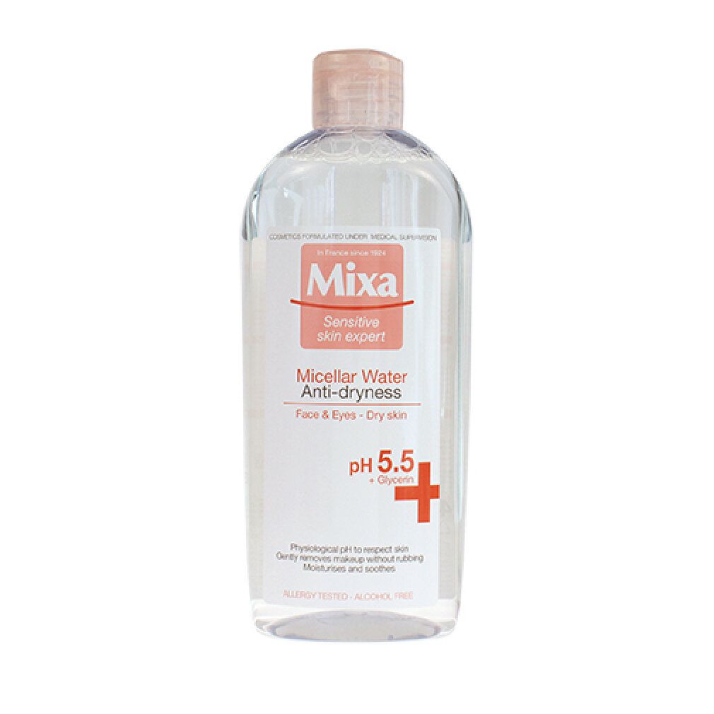 Flacone trasparente con tappo rosa. Etichetta "Mixa", "Micellar Water Anti-dryness" e pH 5.5. Per viso e occhi, pelle secca.