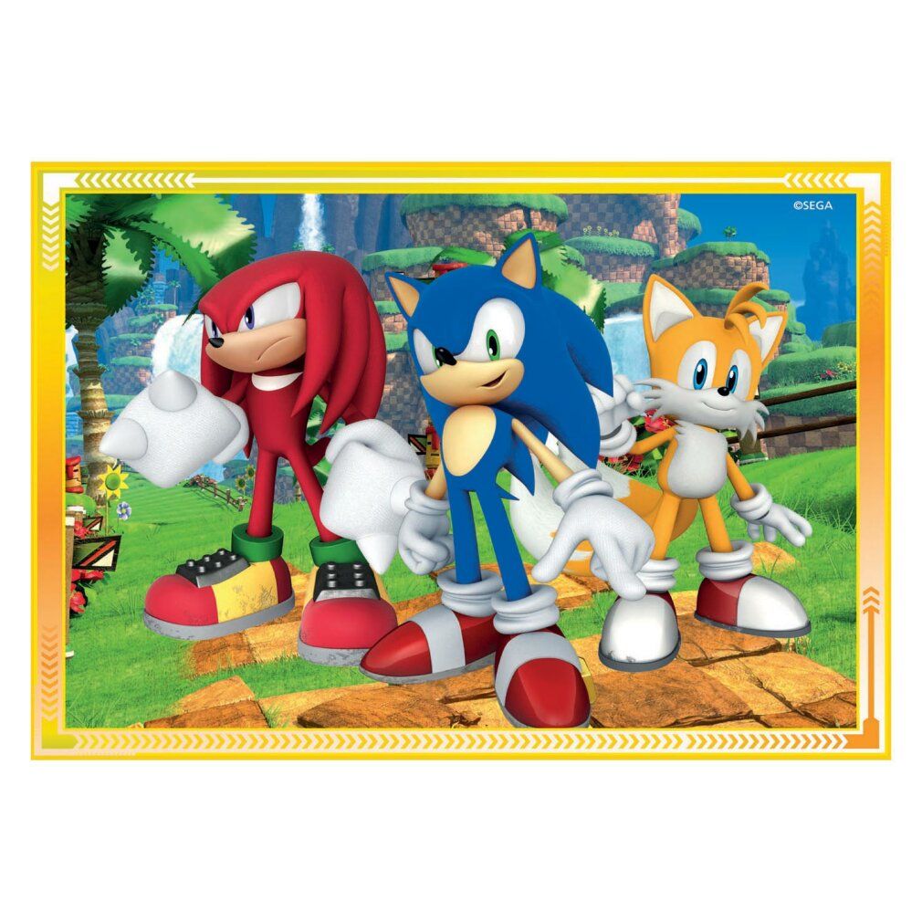 Puzzle con Sonic, Knuckles e Tails. Personaggi su sfondo verde. Cornice gialla con motivo decorativo. Logo Sega.