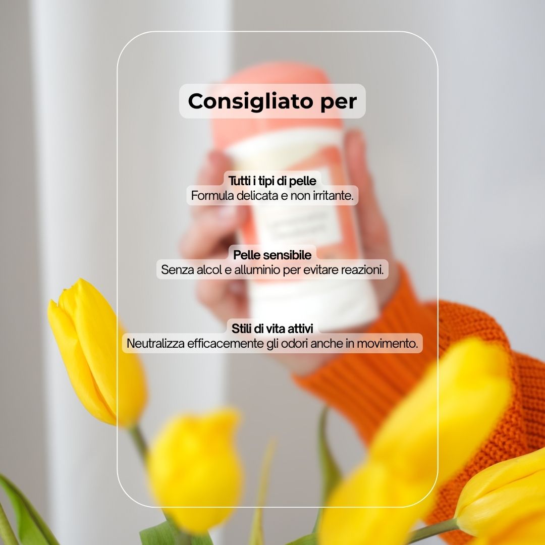 Mano che tiene uno stick deodorante. Testo: Consigliato per: Tutti i tipi di pelle, pelli sensibili, stili di vita attivi. Tulipani gialli.
