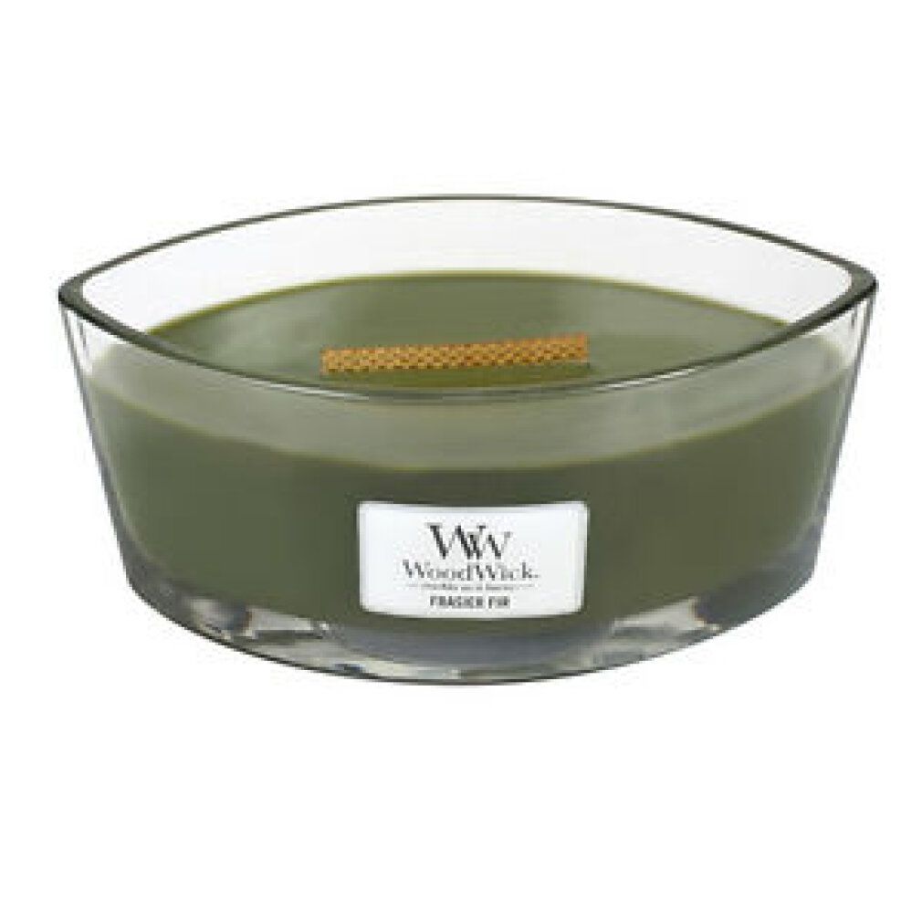 Candela verde WoodWick Frasier Fir in contenitore di vetro ovale.