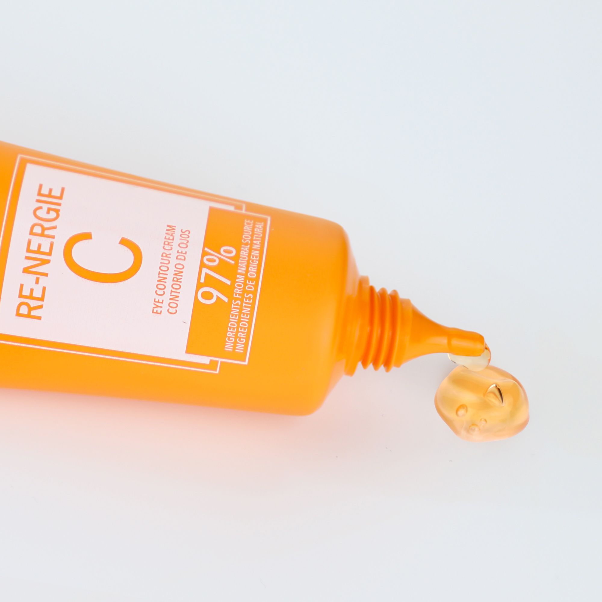 Postquam Re-Nergie C crema contorno occhi. Tubo arancione, prodotto che gocciola. Testo: Eye Contour Cream, 97% ingredienti naturali.