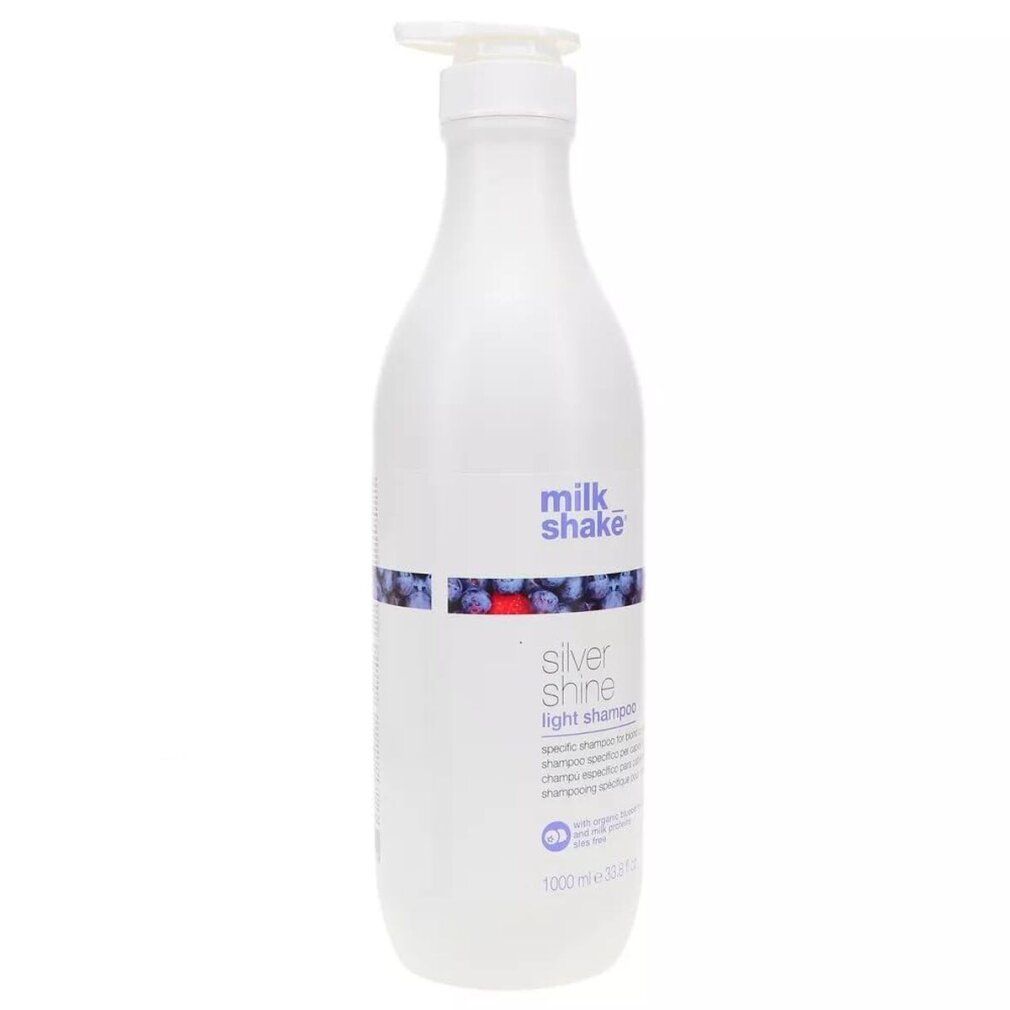 Flacone di shampoo bianco con dosatore. Scritta: milk_shake, Silver Shine light shampoo. 1000 ml.