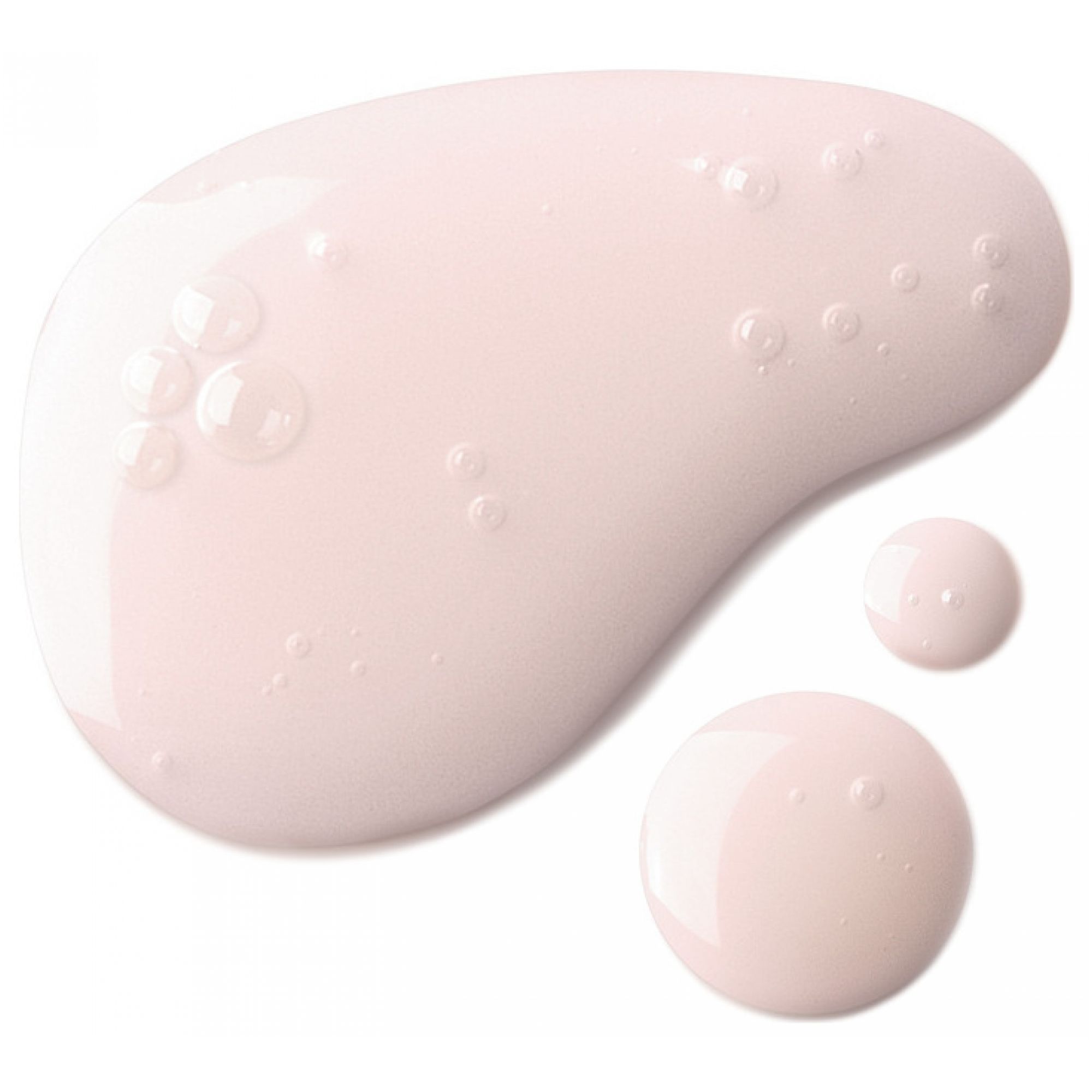 Un liquido rosa pallido con bolle d'aria che si diffonde su una superficie bianca.