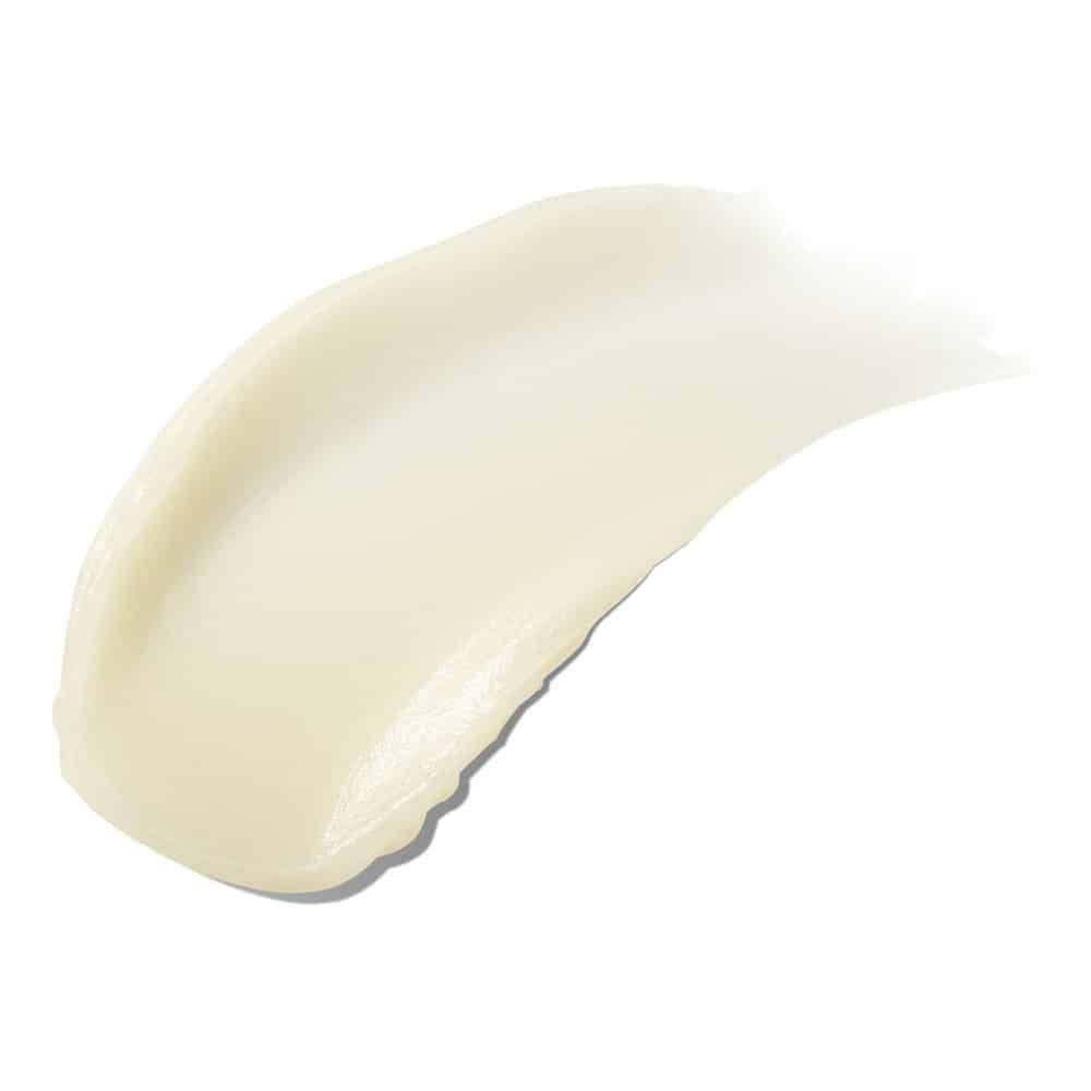 Stesura di crema. Texture chiara, color crema. Su sfondo bianco.