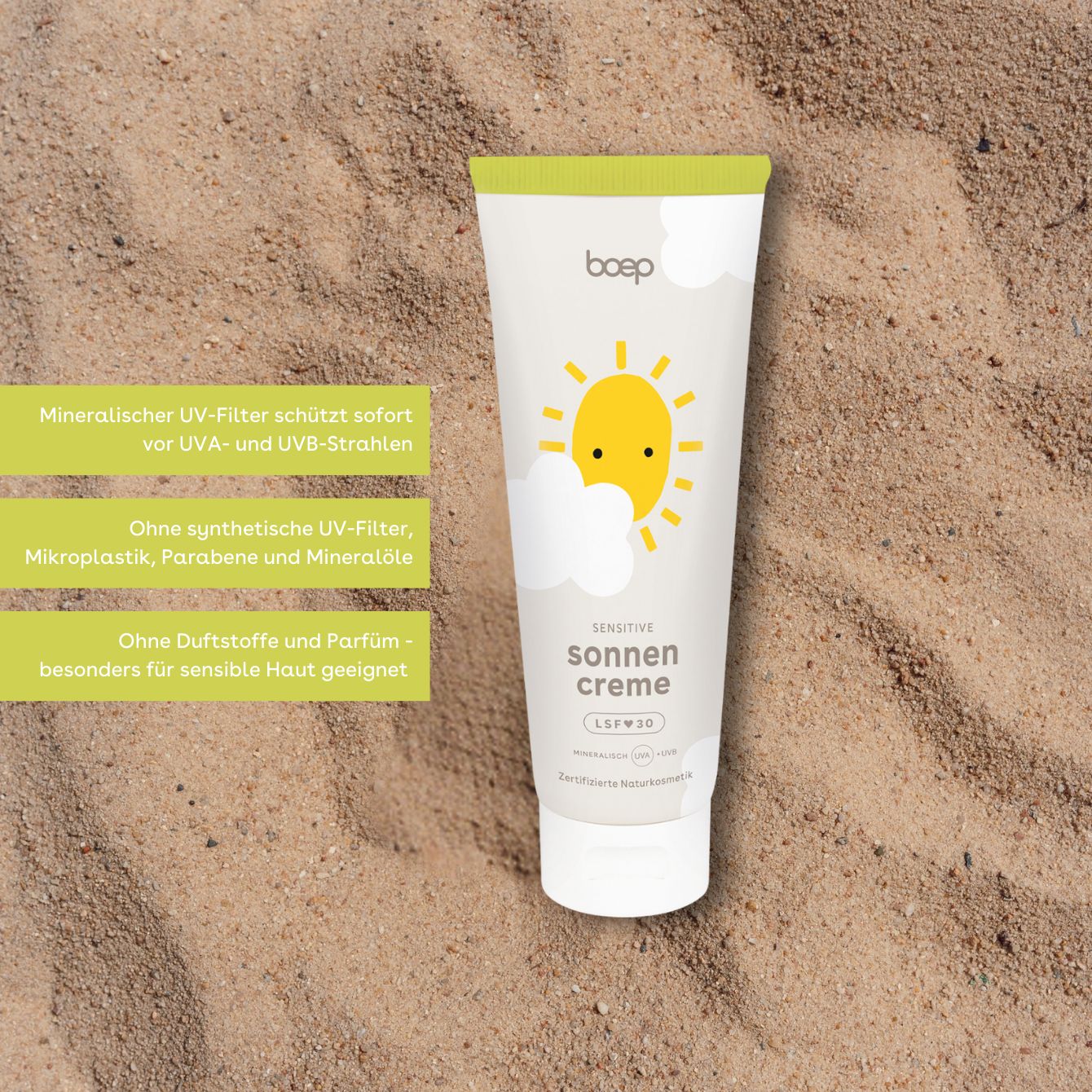 Tubo di crema solare bianco, tappo verde. Stampa: sole, nuvole, "sonnen creme sensitiv LSF 30".