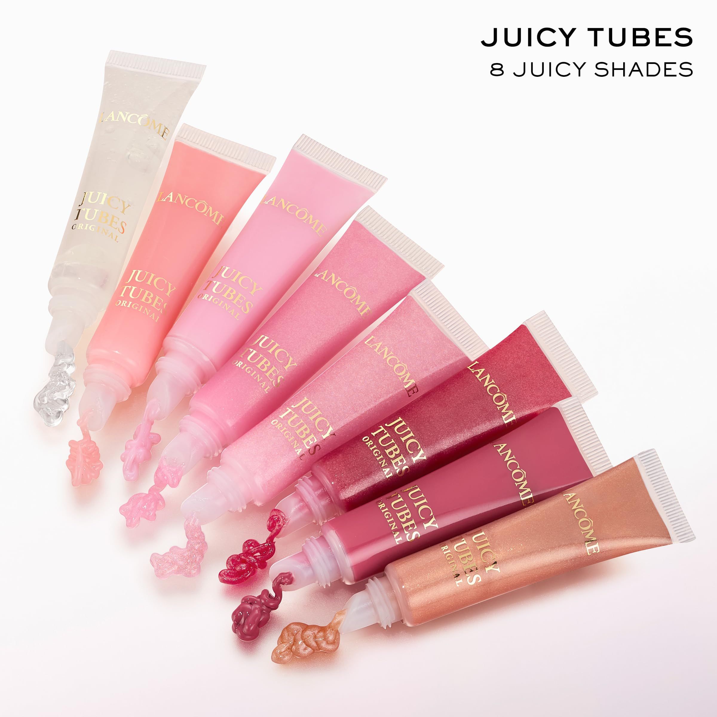 Otto tubetti di lucidalabbra con applicatori. Testo: JUICY TUBES, 8 JUICY SHADES.