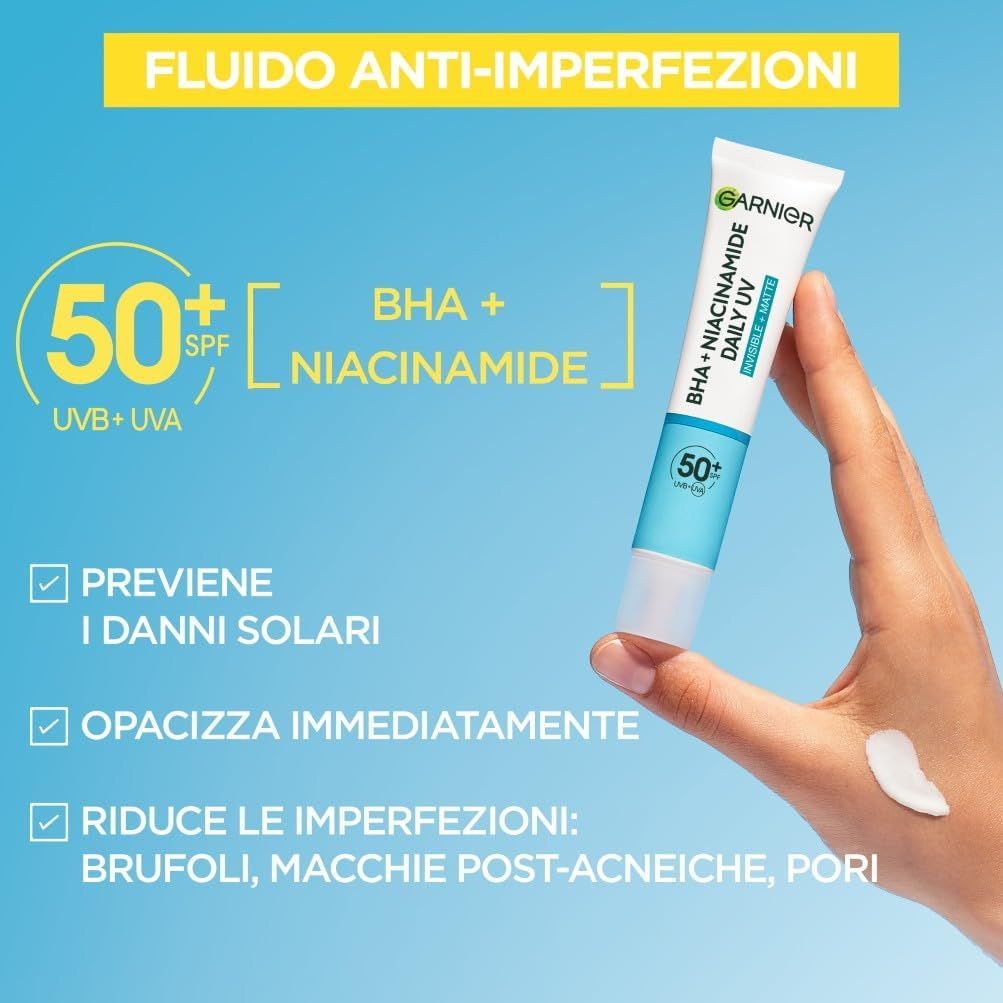 Garnier Hautklar BHA + Niacinamide Daily UV. Tubo con prodotto e mano. Testo: 50+ SPF, BHA + Niacinamide, protezione UV.
