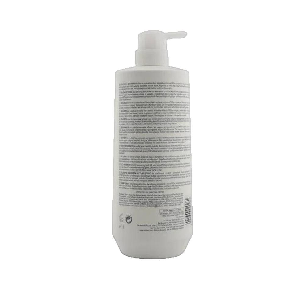 Retro flacone shampoo Goldwell Dual Senses. Bianco, con dosatore. Testo: informazioni prodotto, ingredienti, produttore.