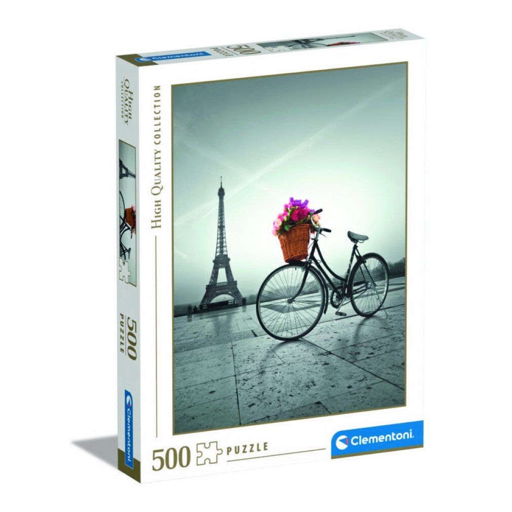 Scatola puzzle con immagine di bicicletta con cesto di fiori davanti alla Torre Eiffel. Marca Clementoni, 500 pezzi.