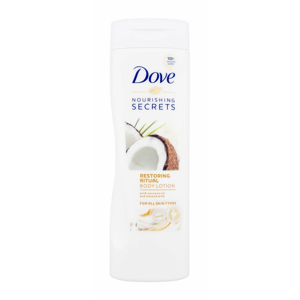 Flacone Dove bianco con illustrazione di cocco. Testo: Nourishing Secrets, Restoring Ritual Body Lotion. Per tutti i tipi di pelle. Con olio di cocco.