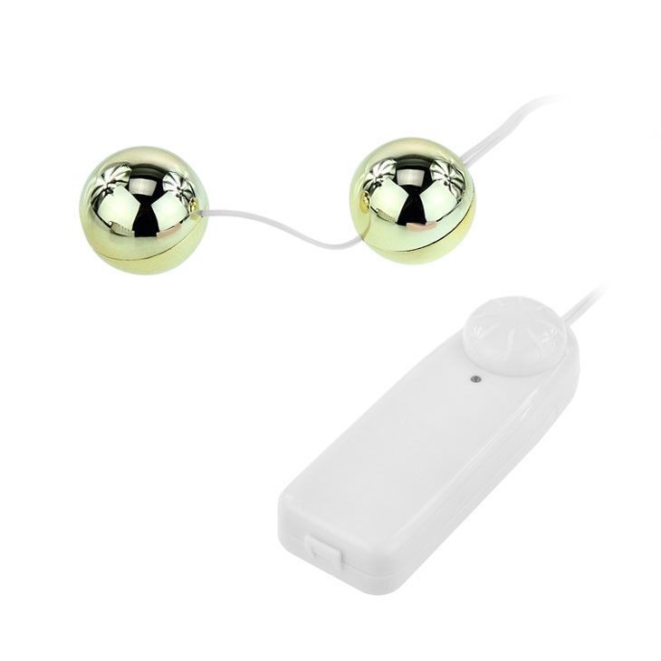 Vibratore dorato con due sfere e controller bianco, vista dall'alto.