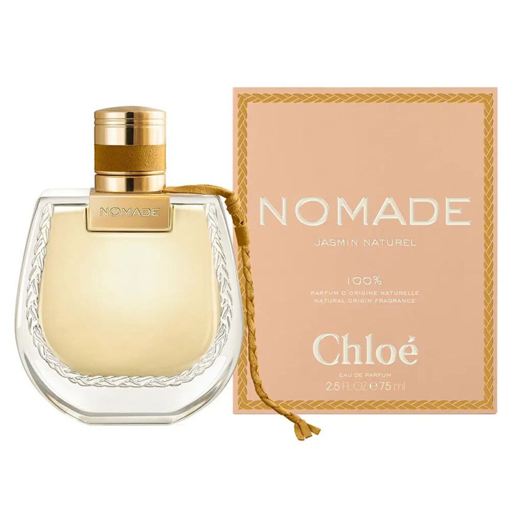 Flacone di profumo con tappo dorato e cordino intrecciato. Accanto, confezione rettangolare con scritta NOMADE e Chloé.