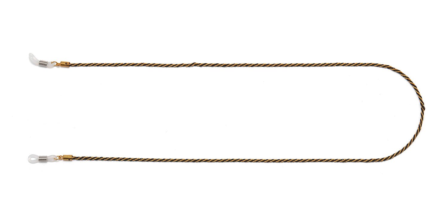 Catenina per occhiali, corda dorata e nera. Anelli trasparenti alle estremità. Sfondo bianco.