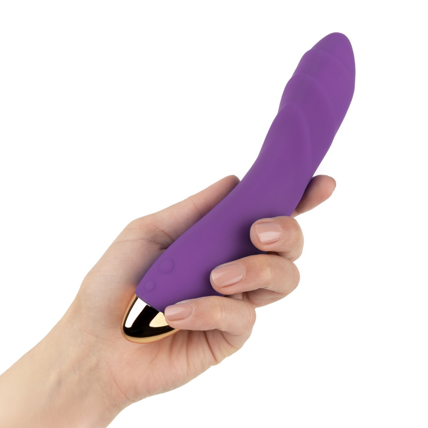 Vibratore viola con punta dorata, tenuto in mano.
