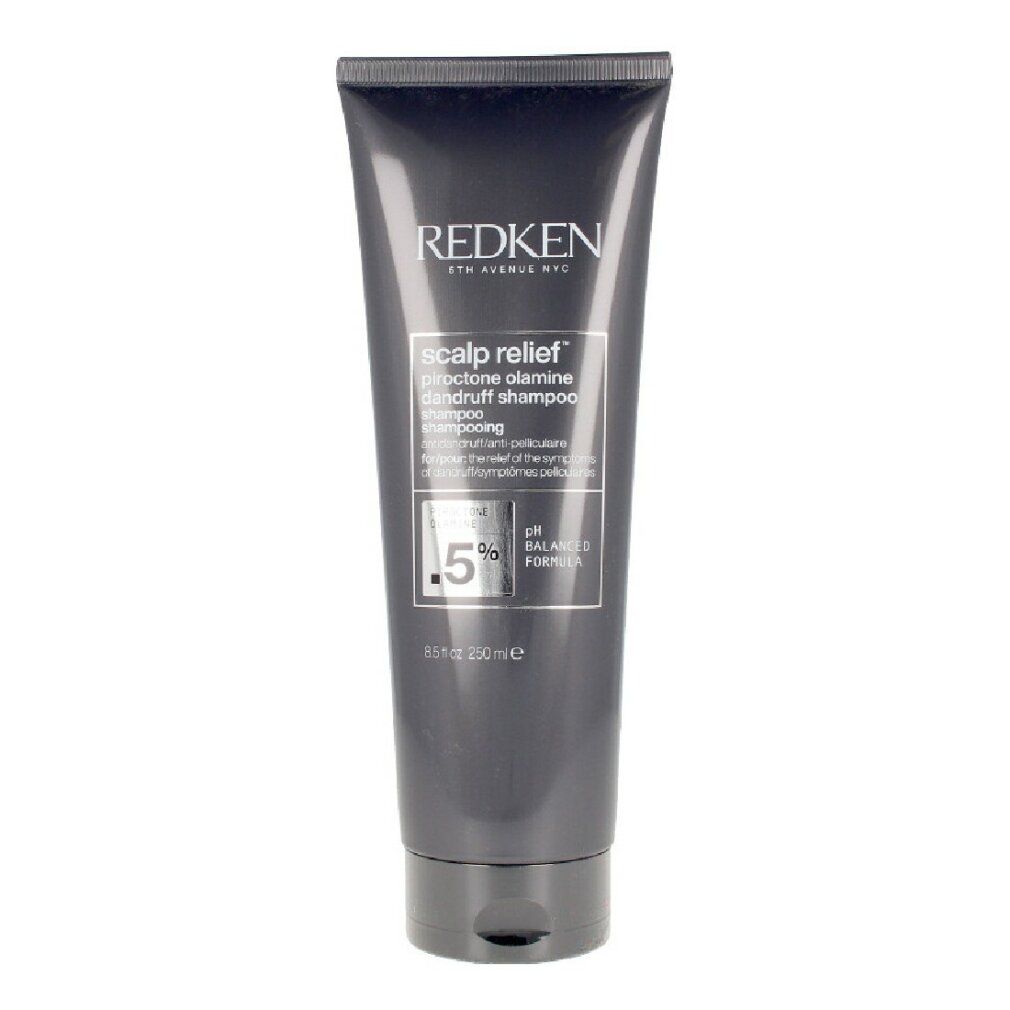 Tubo grigio scuro con informazioni sul prodotto. Scritta: Redken, Scalp Relief, 0,5% Piroctone Olamine, pH bilanciato.