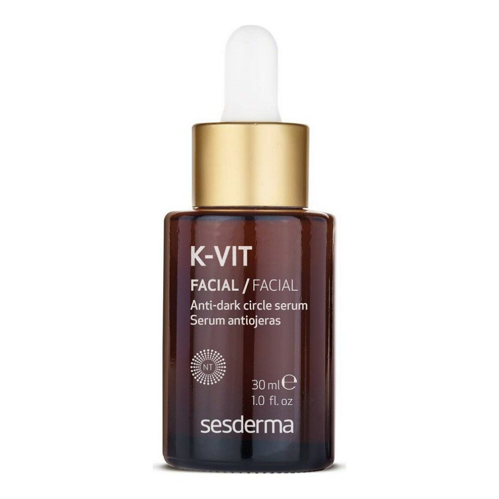 Flacone di vetro marrone con tappo dorato e pipetta. Scritta: K-Vit Facial, siero anti-occhiaie. Sesderma. 30 ml.