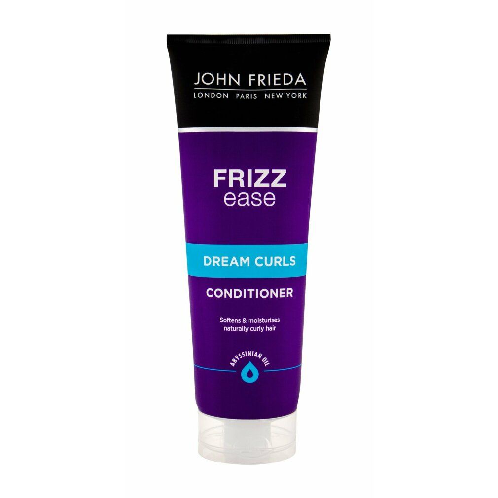 Conditioner John Frieda Frizz Ease Dream Curls. Tubo viola con testo blu. Contiene olio di Abissinia. Testo: Dream Curls, Conditioner.