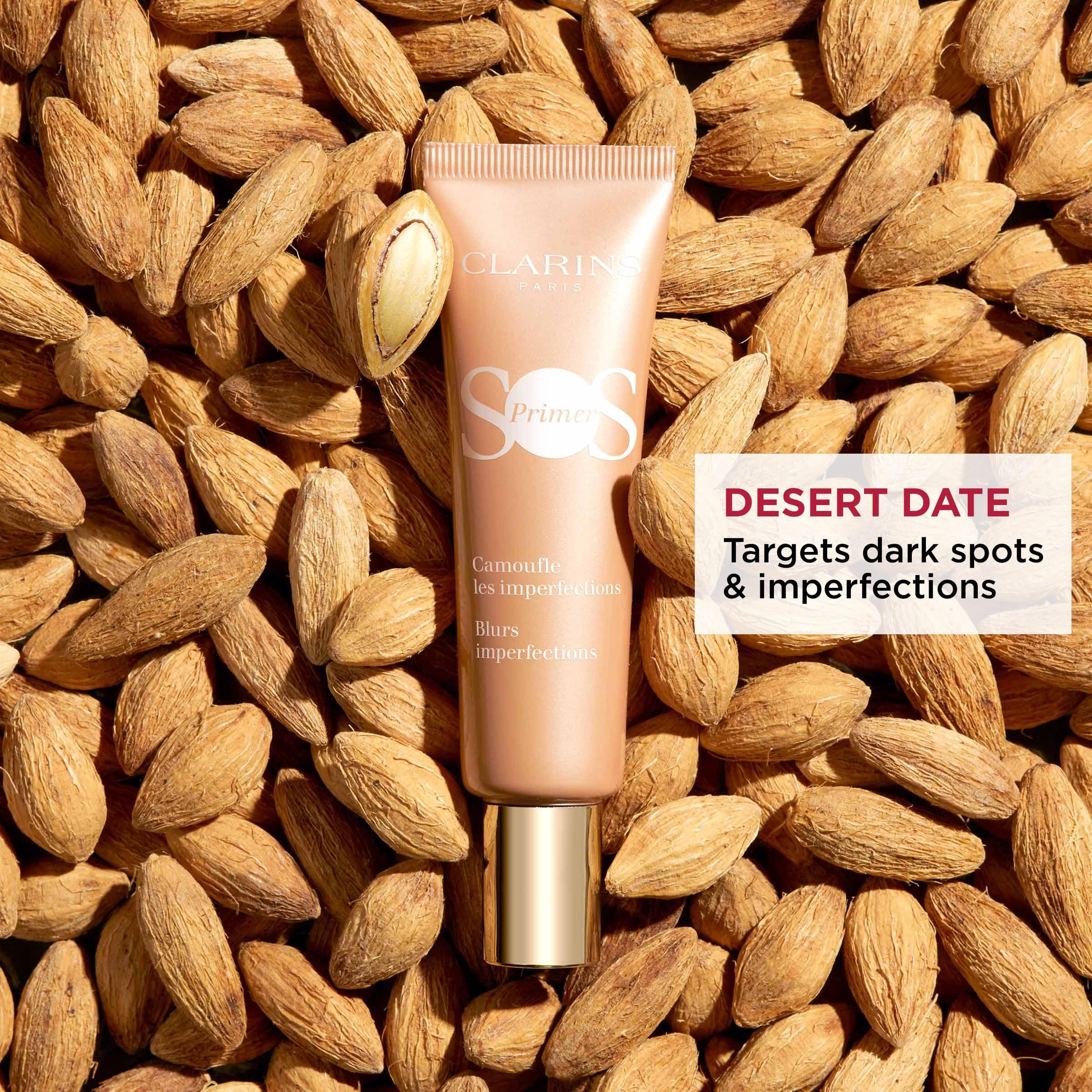 Tubo CLARINS SOS Primer Peach su mandorle. Testo: Desert Date, imperfezioni.