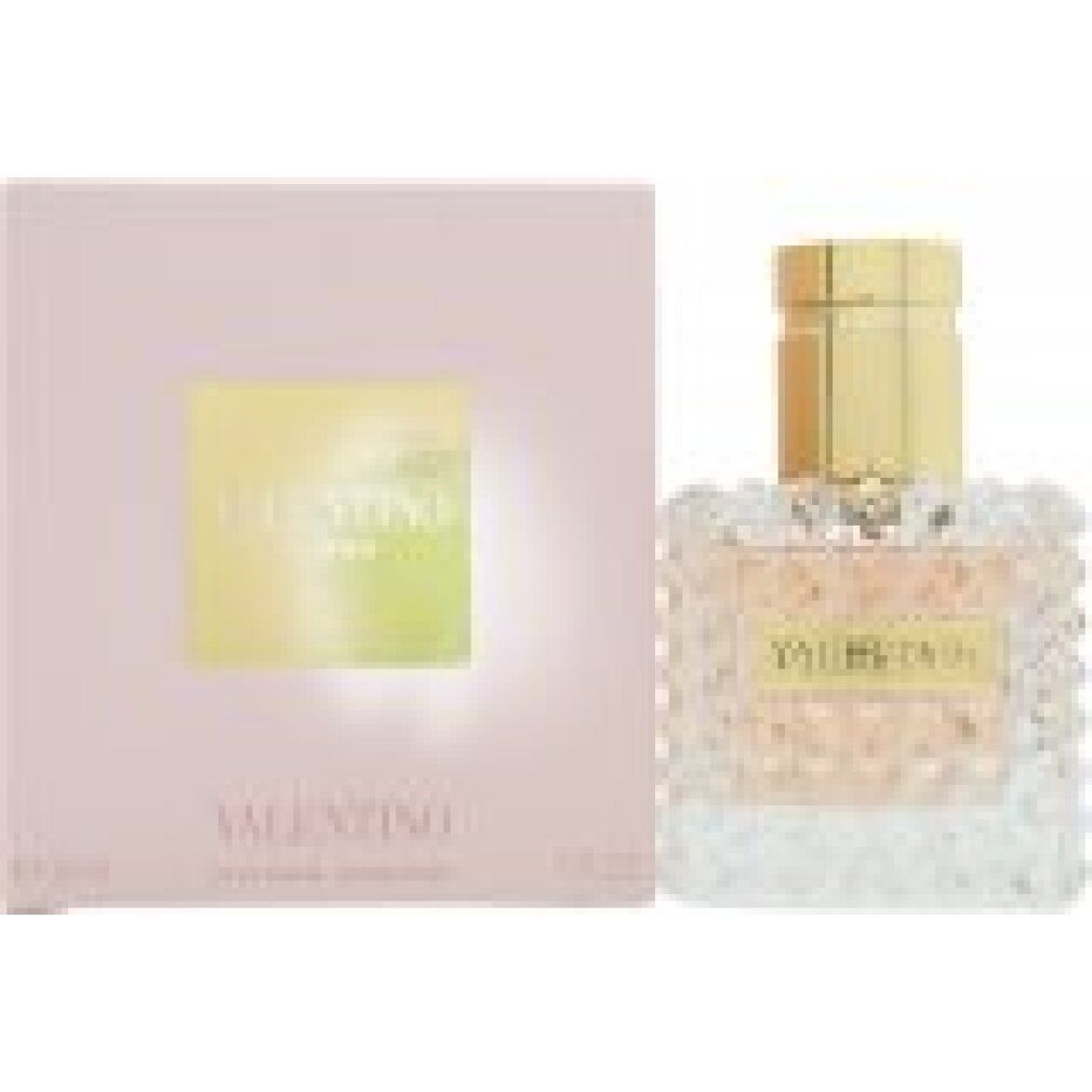 Flacone e confezione. Flacone quadrato, tappo dorato, scritta VALENTINO. Liquido rosa. Confezione rosa con logo.