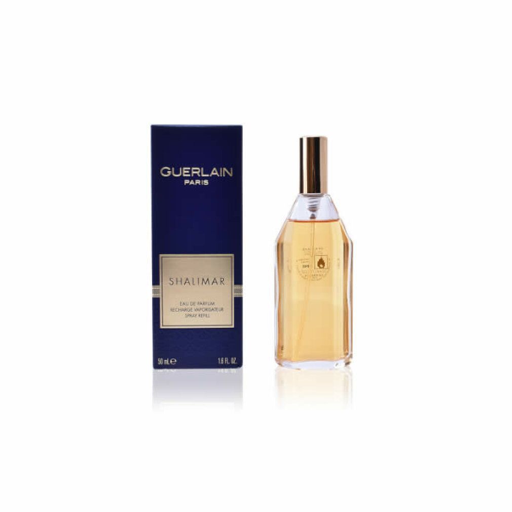 Scatola blu scuro e flacone. GUERLAIN PARIS e SHALIMAR sulla scatola. Flacone trasparente con tappo dorato.