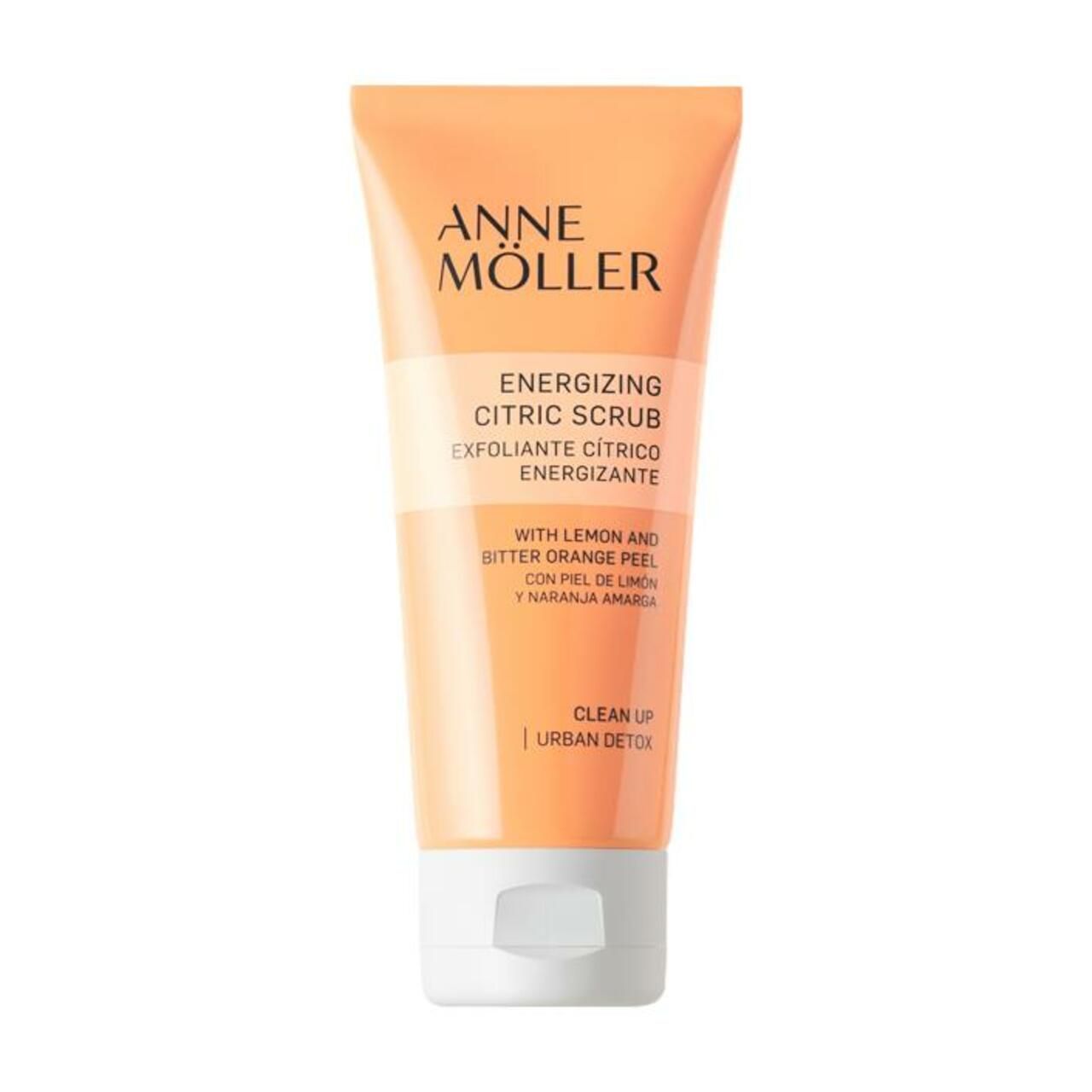 Tubo arancione con tappo bianco. Scritta: Anne Möller, Energizing Citric Scrub. Con scorza di limone e arancia amara.
