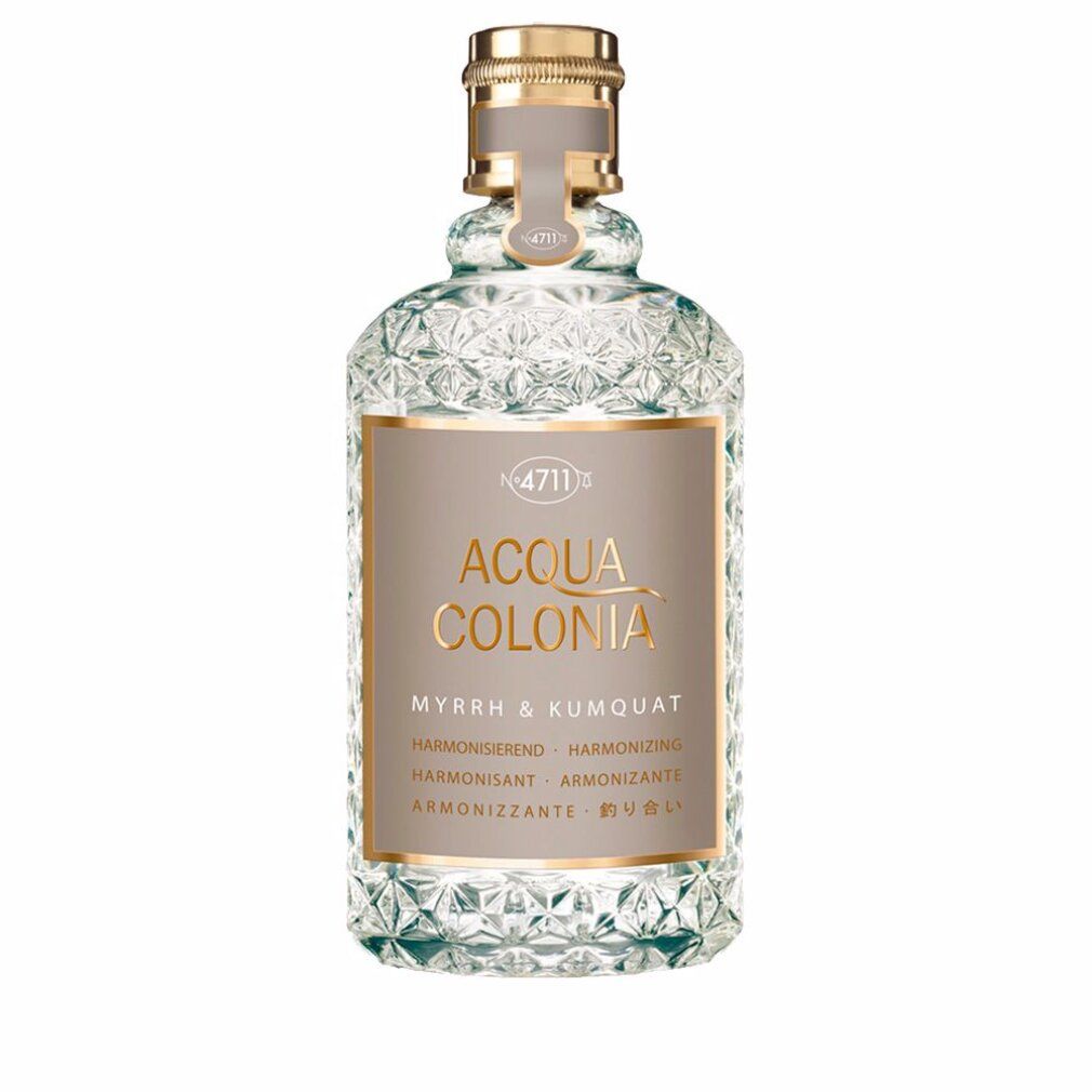 Flacone in vetro con tappo dorato. Scritta: Acqua Colonia Myrr & Kumquat. Etichetta con testo in più lingue.