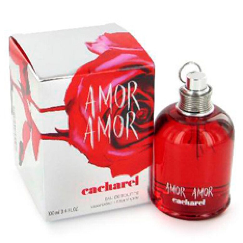 Flacone di profumo rosso e scatola. Sulla scatola: AMOR AMOR, Cacharel, rosa rossa. Flacone: AMOR AMOR, Cacharel.