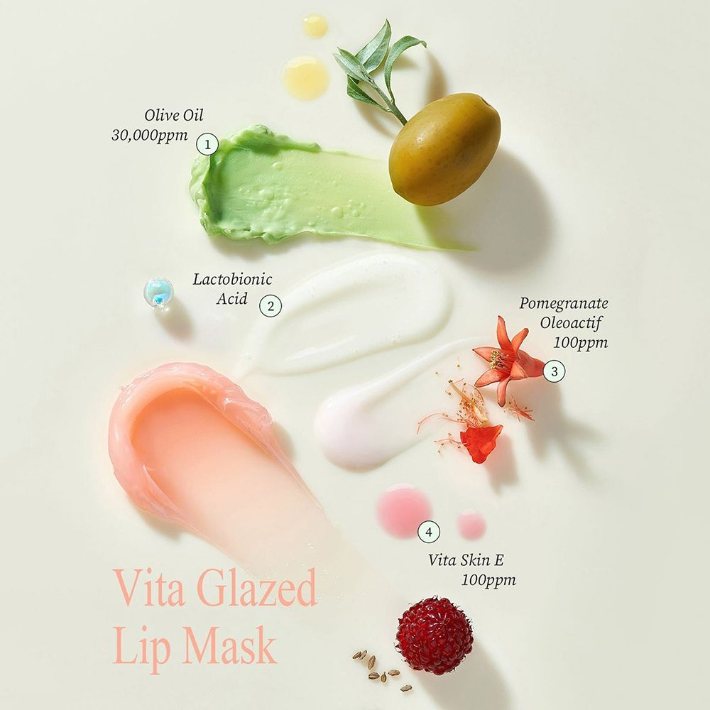 Ingredienti: Olio d'oliva, acido lattobionico, melograno, Vitaskin E. Testo: « Vita Glazed Lip Mask ».