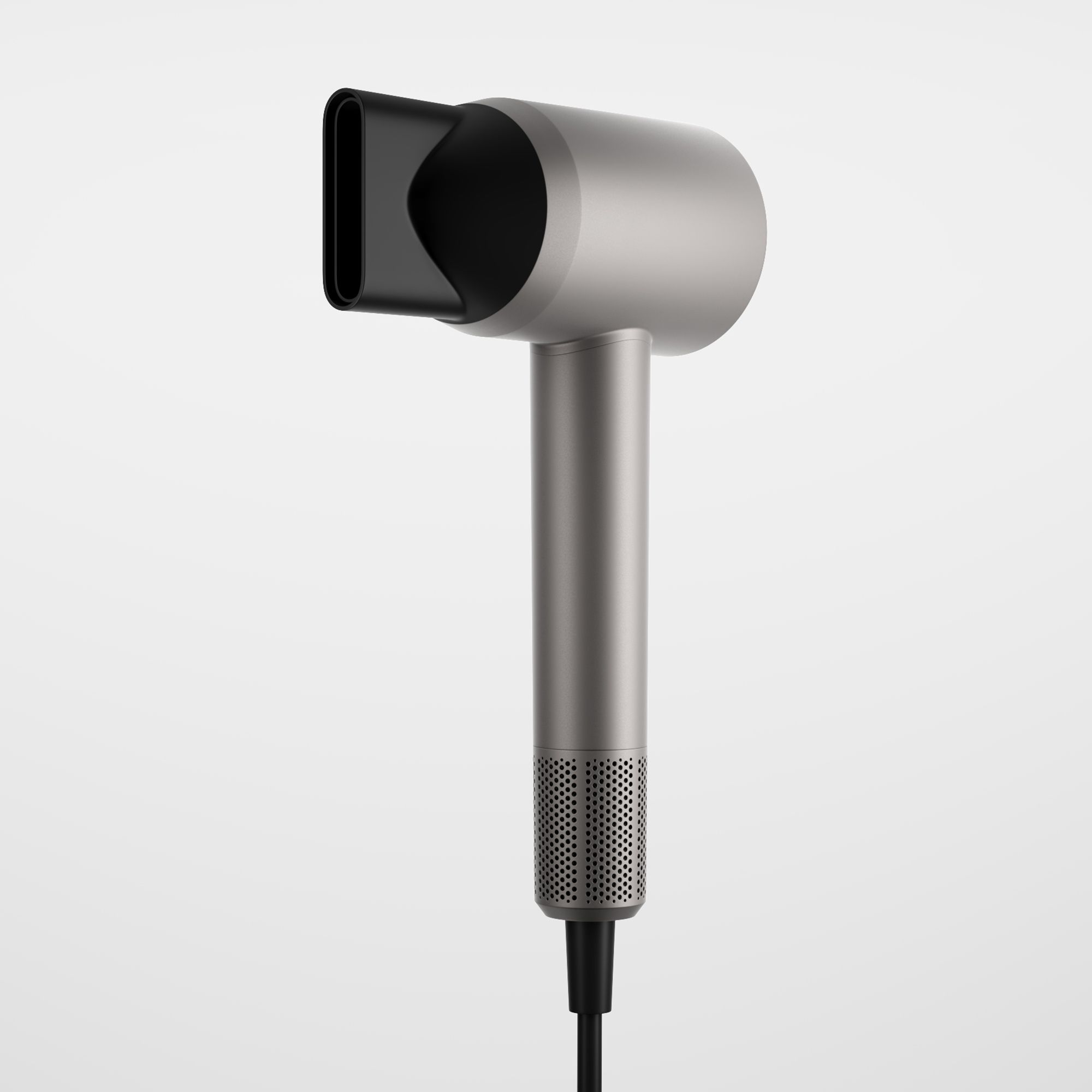 Asciugacapelli grigio con ugello nero. Testa cilindrica, impugnatura con pulsanti ed estremità perforata. Cavo di alimentazione nero.