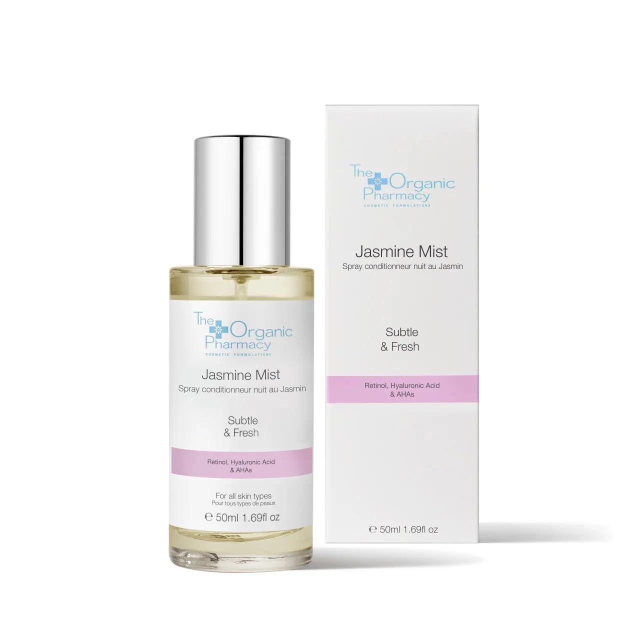 Flacone in vetro con tappo argentato e scatola. Etichetta rosa con testo. Marchio: The Organic Pharmacy. Scritta: Jasmine Mist.