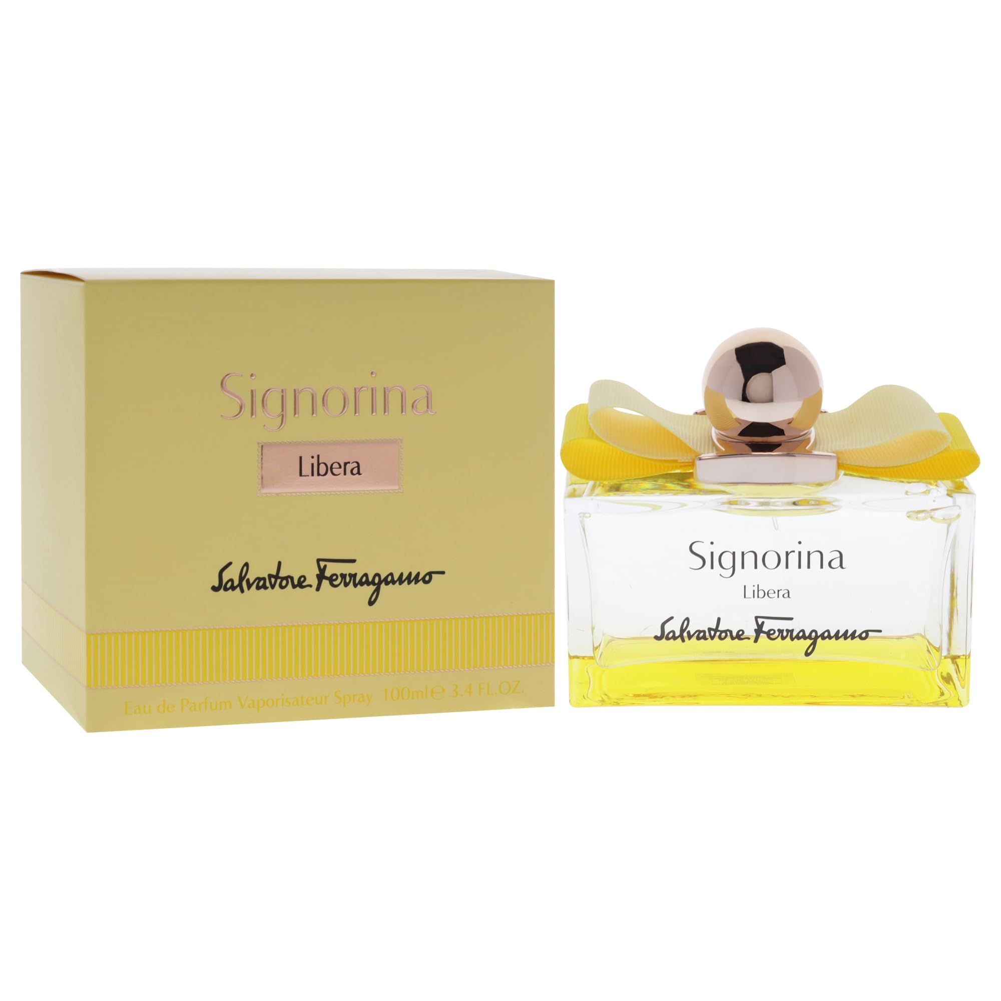 Flacone di profumo e scatola. Flacone con liquido giallo, tappo dorato e fiori. Scatola con scritta Signorina Libera.
