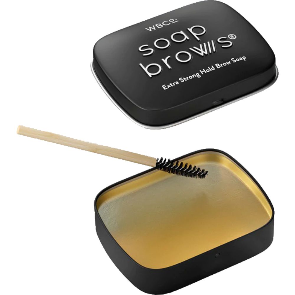 Scatola Soap Brows aperta con spazzola. Scatola nera con interno dorato. Spazzola con manico in legno.
