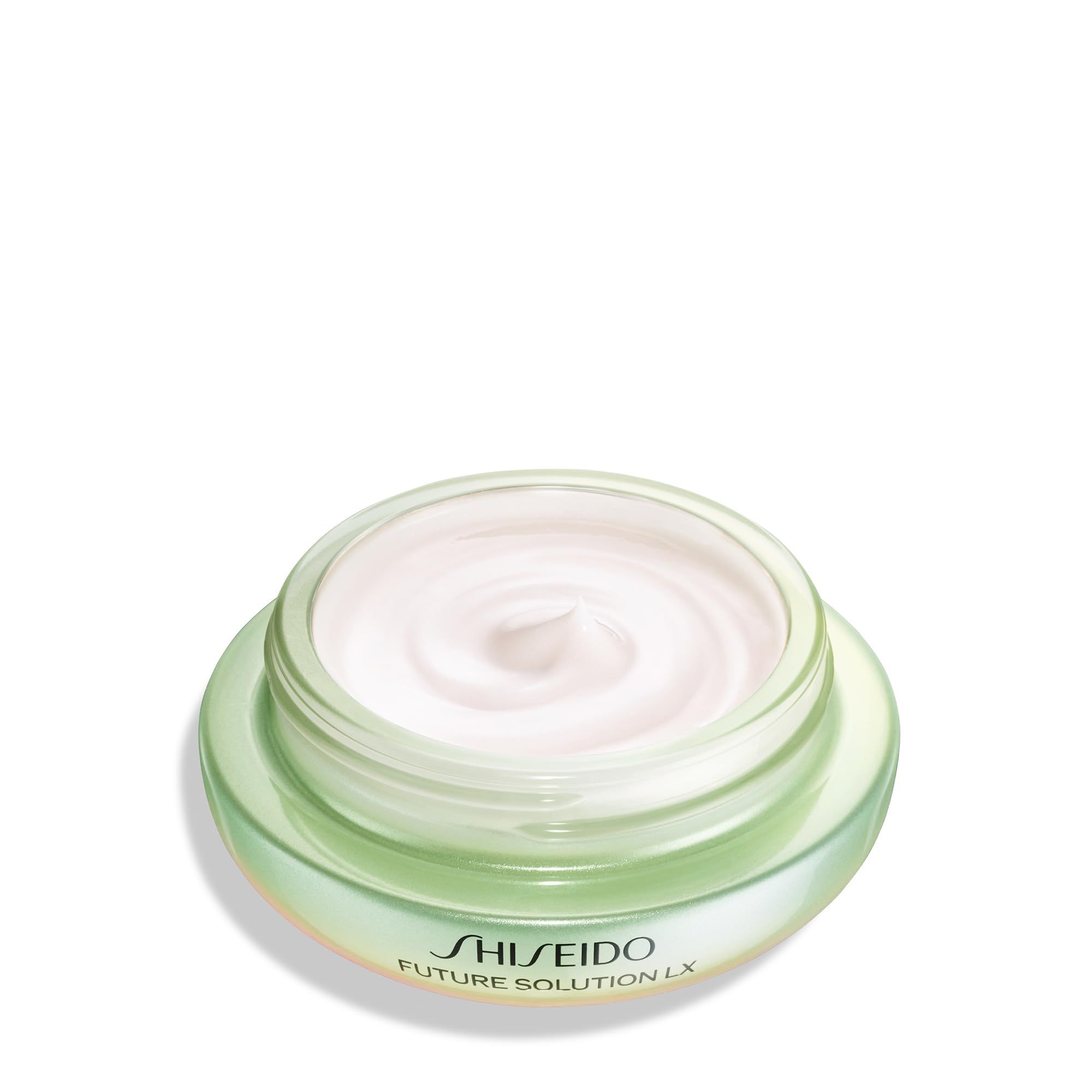 Vasetto aperto con crema. Coperchio verde, base trasparente. Scritta: SHISEIDO FUTURE SOLUTION LX.