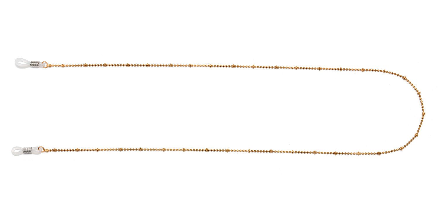 Catena per occhiali dorata a pallini. Anelli in silicone trasparente alle due estremità per le aste.