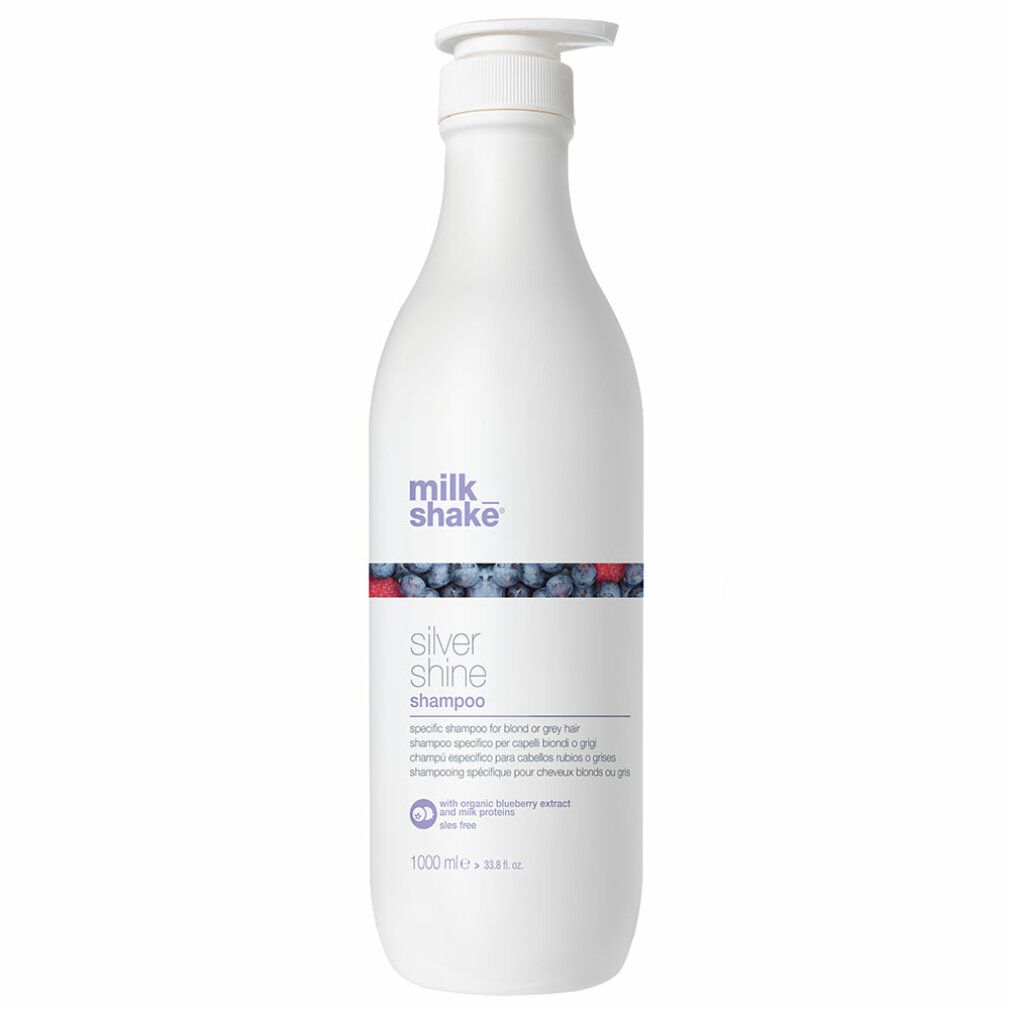 Flacone bianco con dosatore. Scritta: milk_shake Silver Shine Shampoo. Decorazione blu e rossa. 1000 ml.