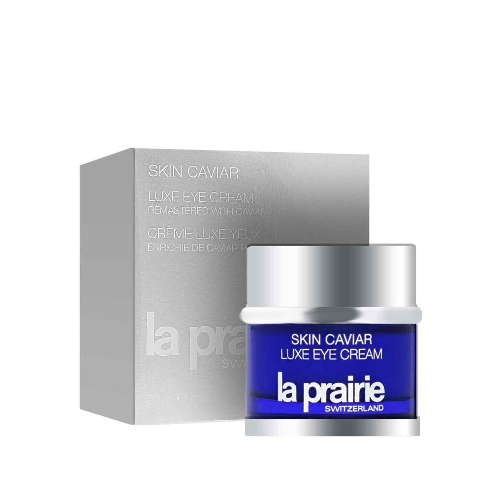Vasetto blu con coperchio argentato e scatola. Scritta: Skin Caviar Luxe Eye Cream, La Prairie.