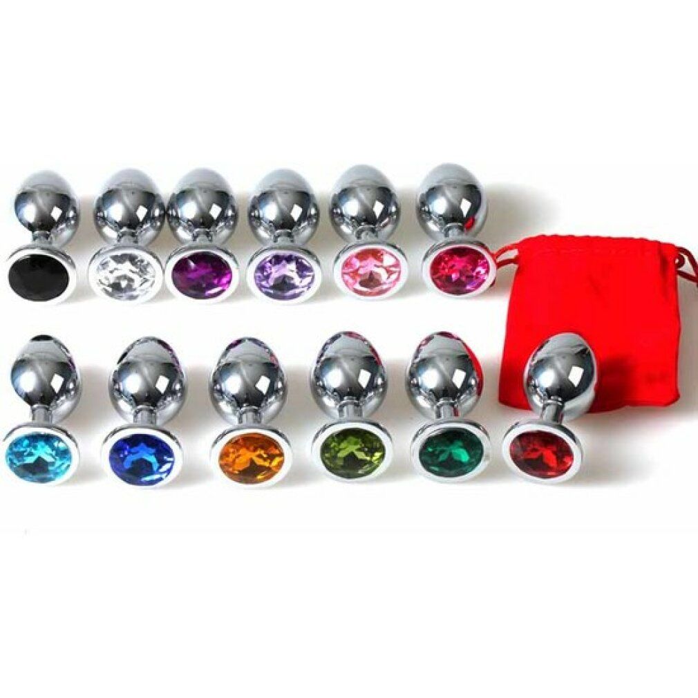 Diversi plug anali con pietre colorate. Metallo lucido. Forma conica con punta arrotondata e base rotonda.