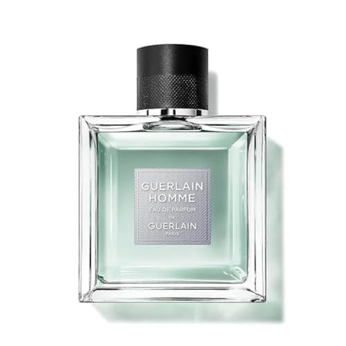 Flacone quadrato in vetro con tappo nero. L'etichetta riporta Guerlain Homme Eau de Parfum.