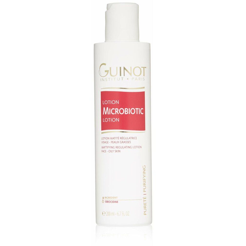 Flacone bianco con etichetta rossa. Logo Guinot e nome del prodotto Microbiotic Lotion. Testo: Lotion Matifiante Régulatrice.